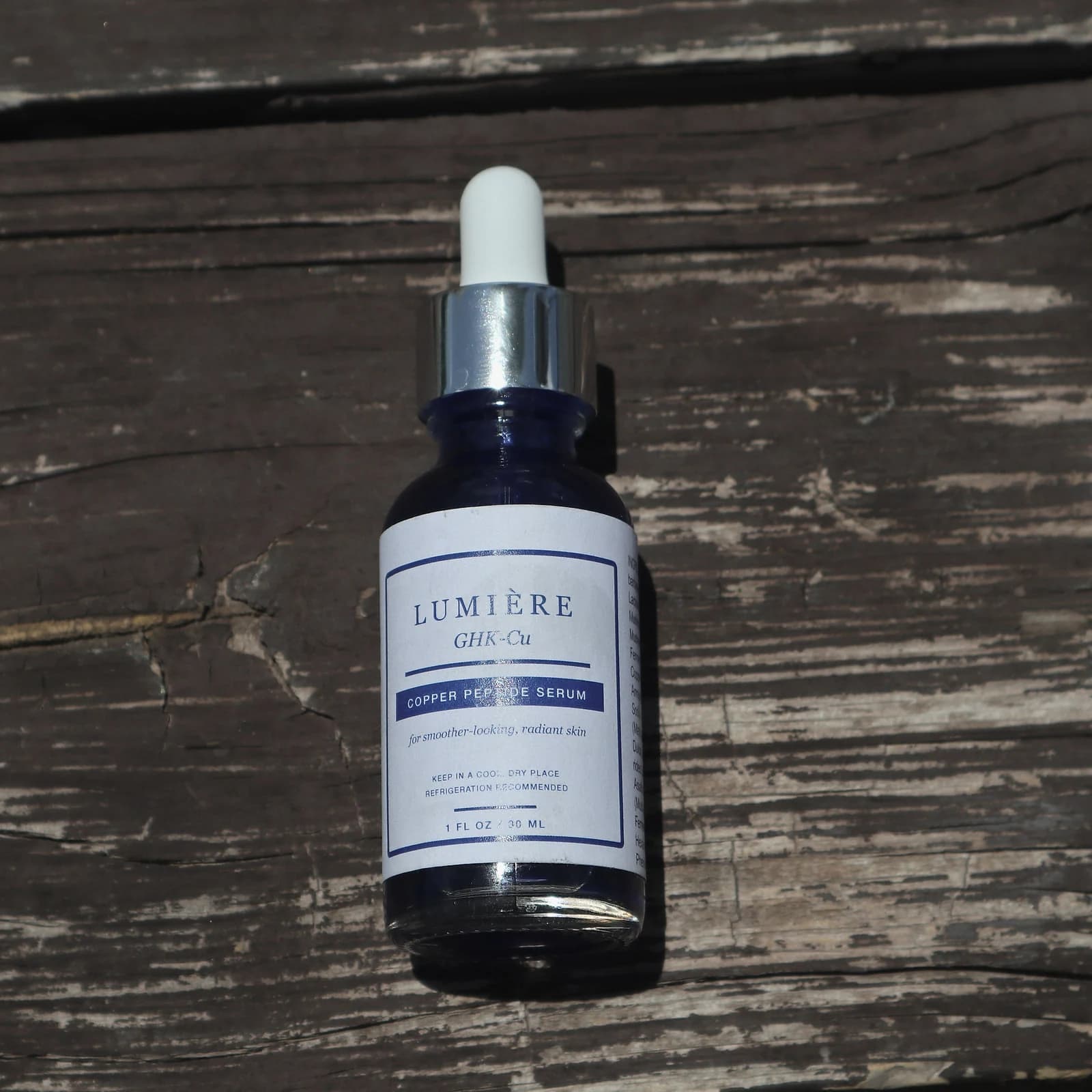 A top-down photograph of the serum bottle and dropper